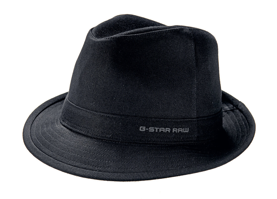 Close-up of black hat on white background