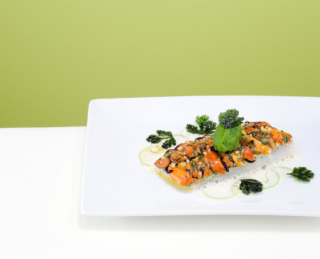 John dory with shellfish shed and lemongrass on plate