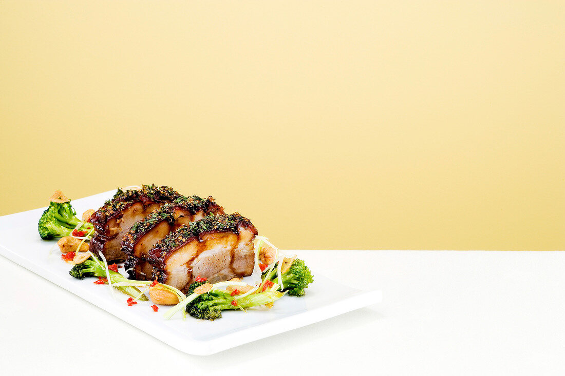Lacquered young pork belly on plate