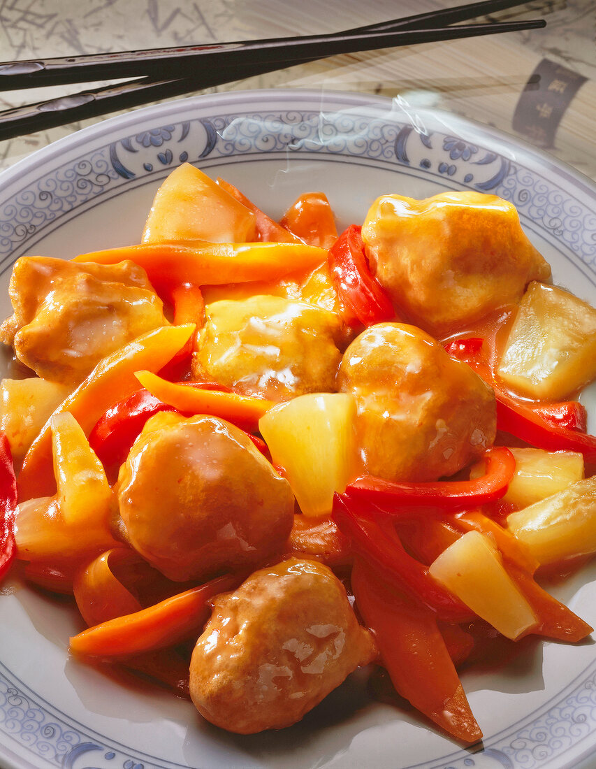 Close-up of pork with pineapple on plate