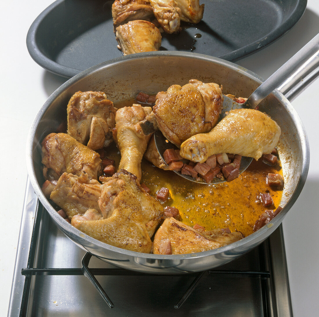 Removing spring chicken pieces with ham from pan, step 4