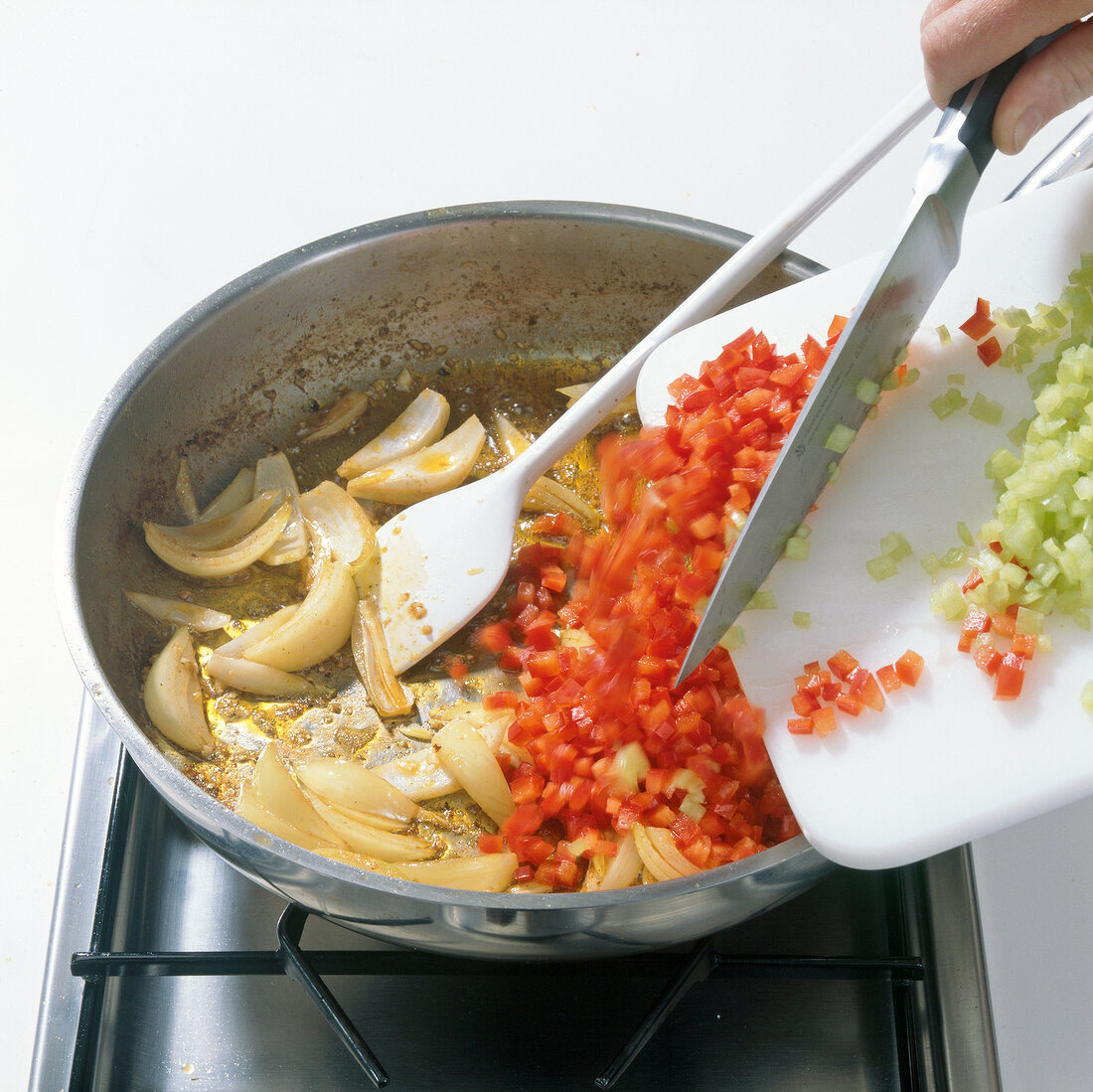 Adding various diced vegetables in pan, step 5