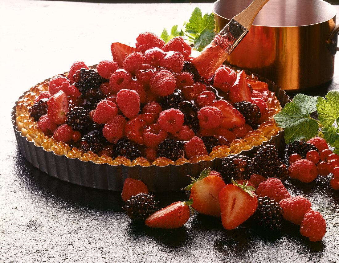 Tart with strawberries, raspberries, blackberries and currants