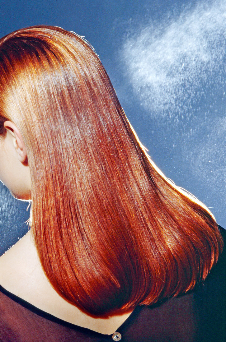 Rear view of brunette woman with long shiny hair