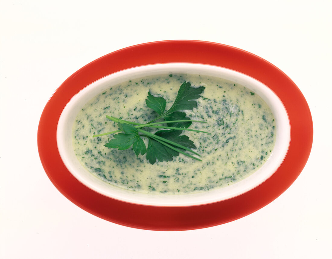 Chives herb sauce with coriander in bowl on white background