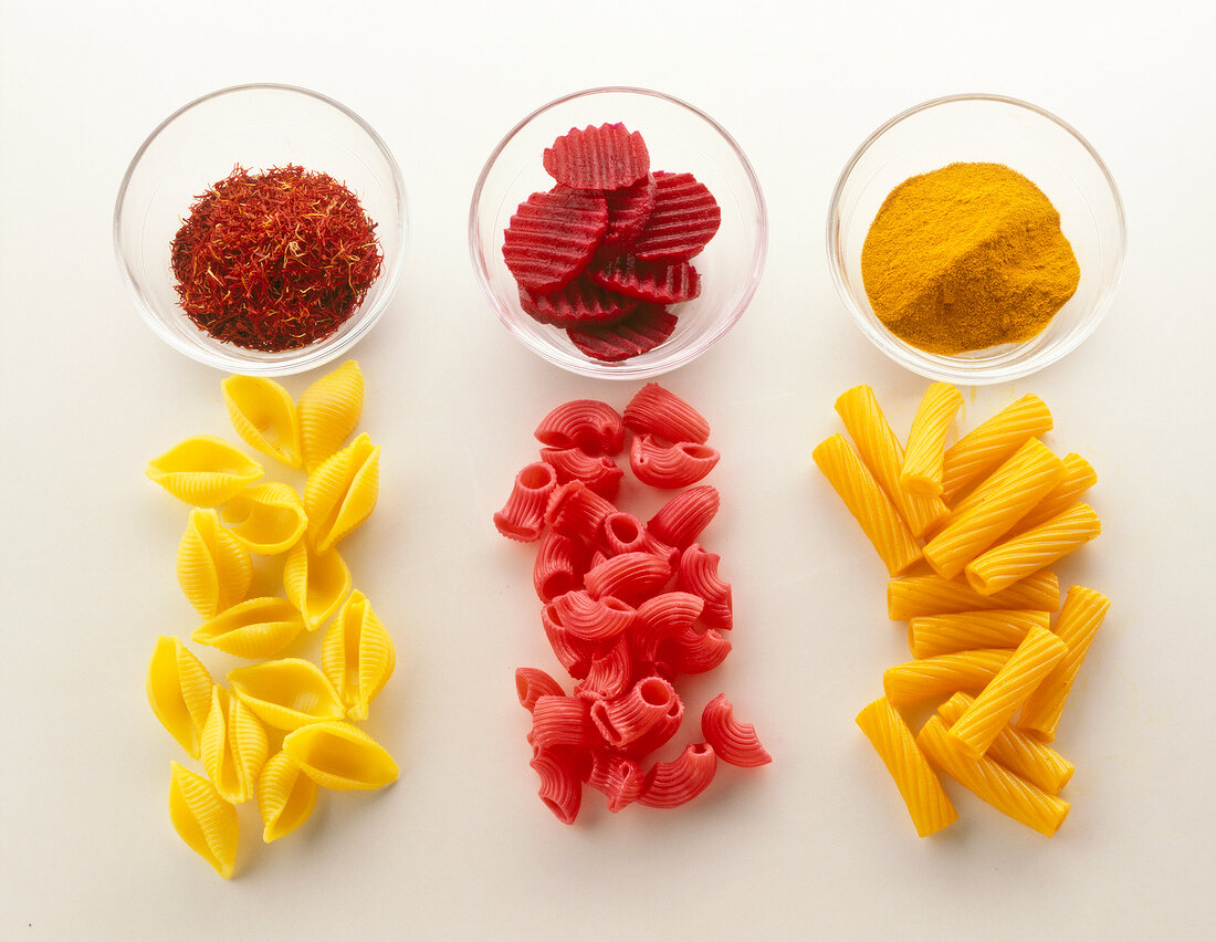 Saffron, beetroot and turmeric in bowls as dying agents for pasta
