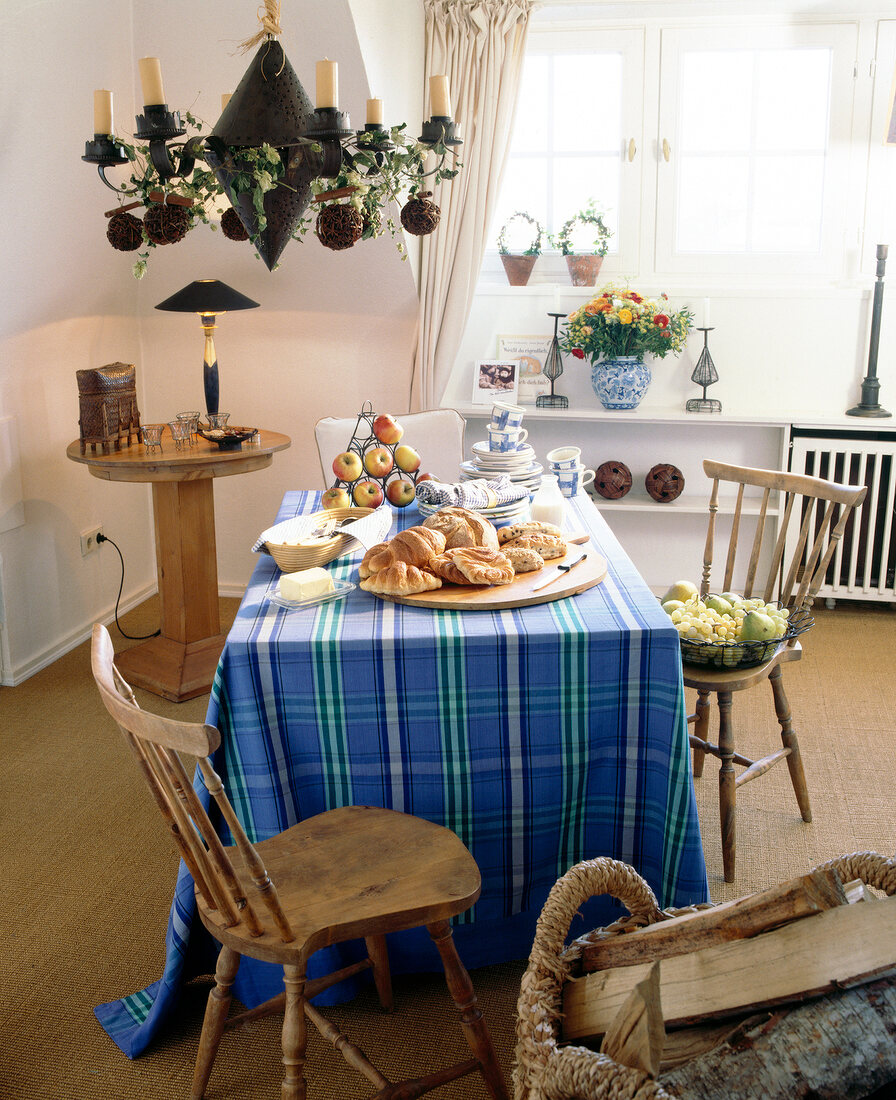 Table with blue checkered table cloth and breakfast laid out