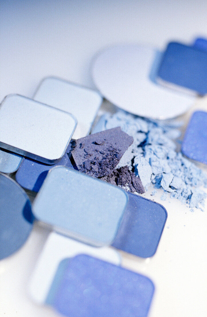 Close-up of various eye shadow in blue tones