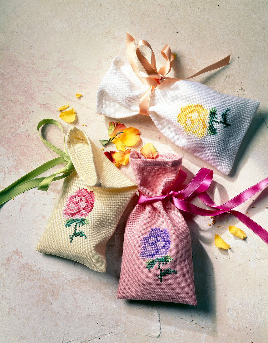 Close-up of yellow, white and pink rose sachet