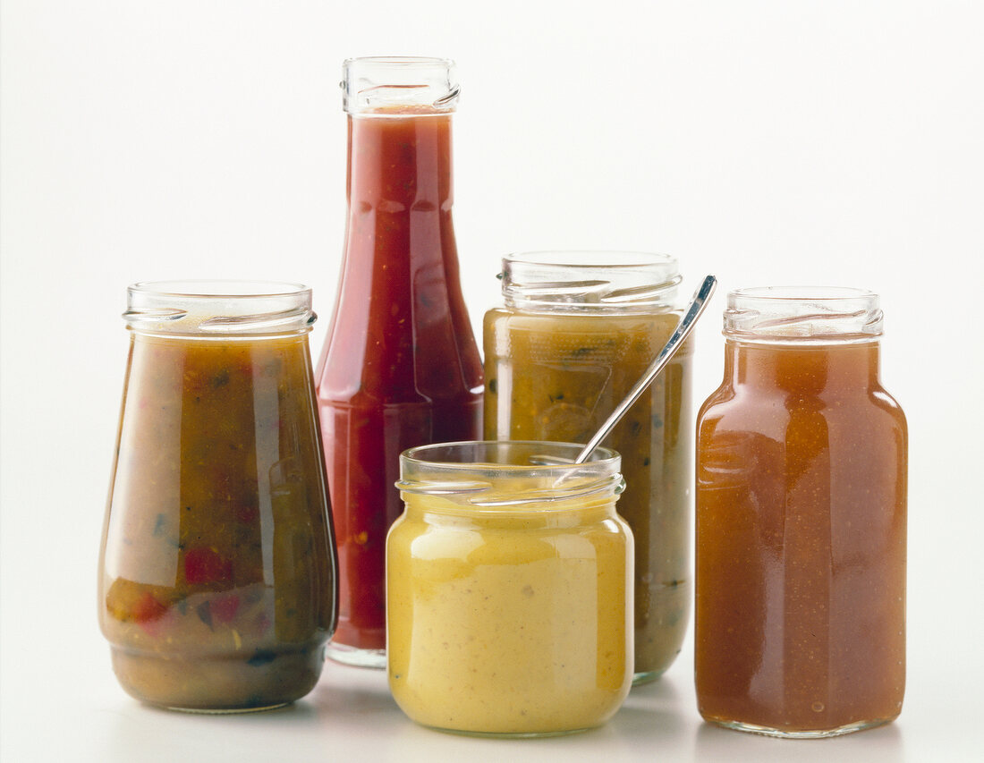 Relishes, salsa, dip and chutney in glass bottles
