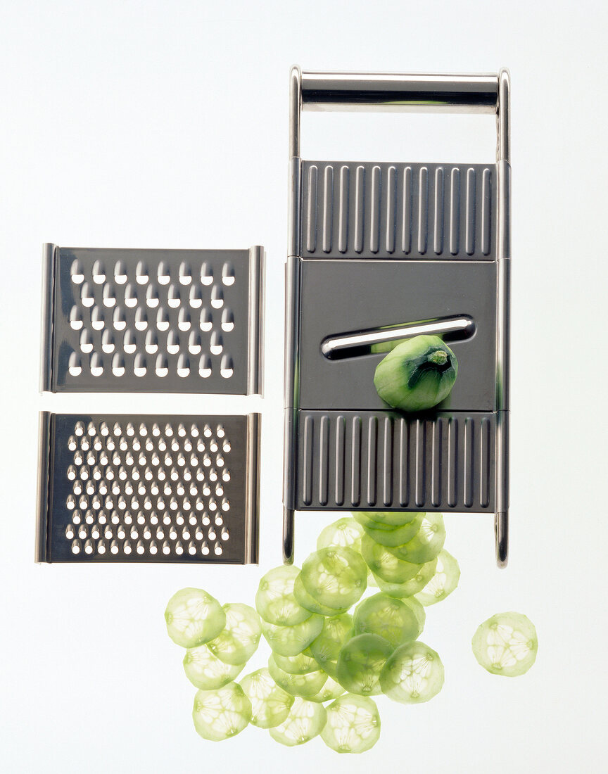 Cucumber sliced with all purpose grater on white background