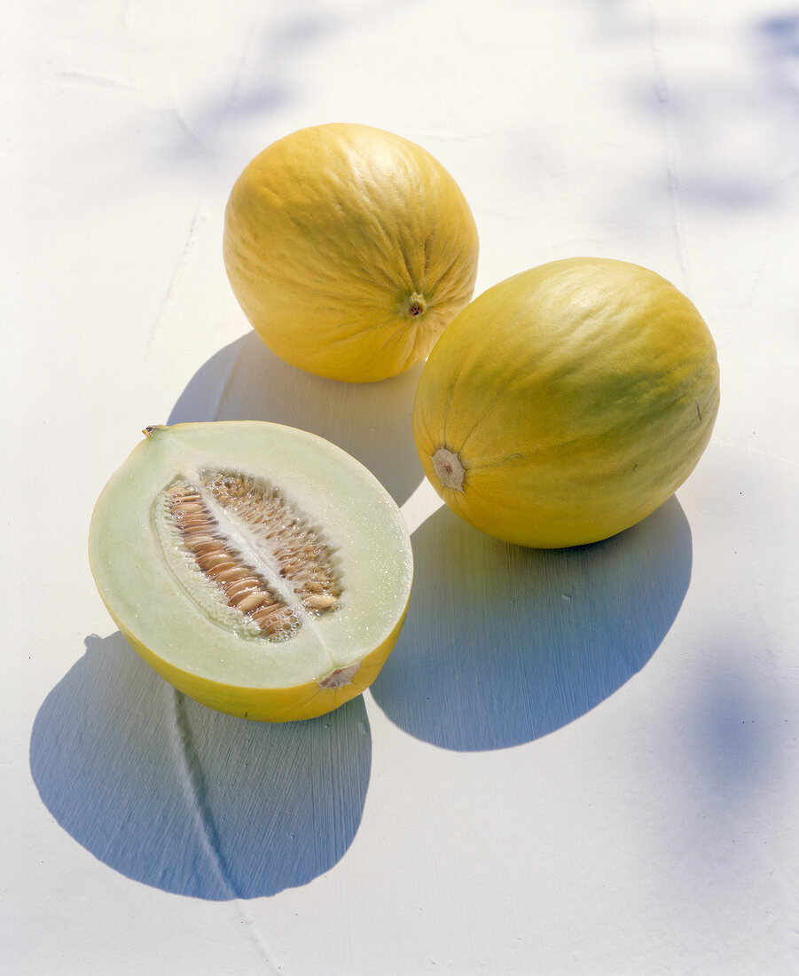 Round muskmelon on white surface