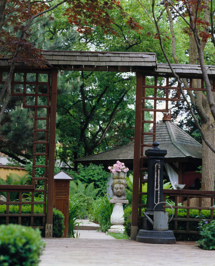 Asian styled gate with tea pavilion on garden terrace