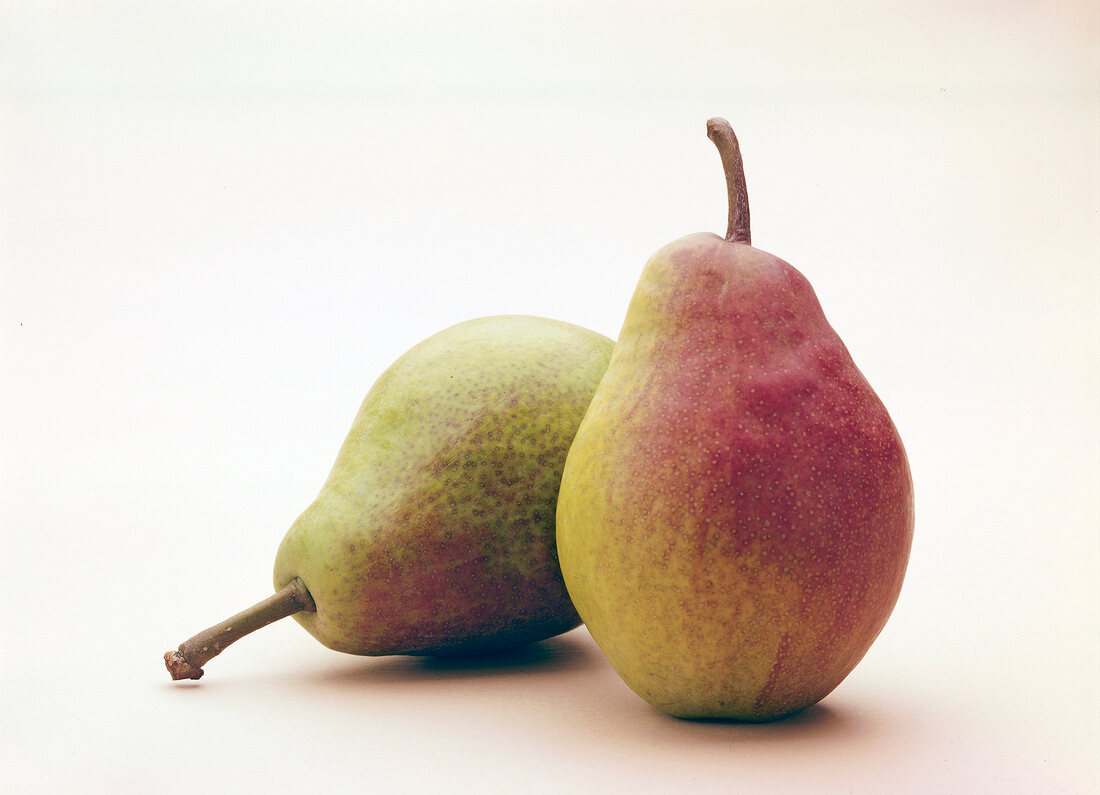 Two alexander lucas pears on white background