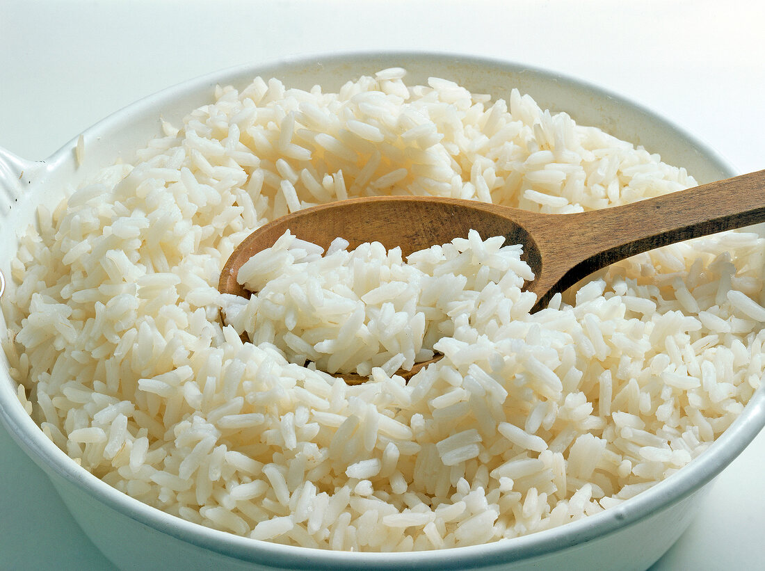 Close-up of cooked rice in bowl with spoon