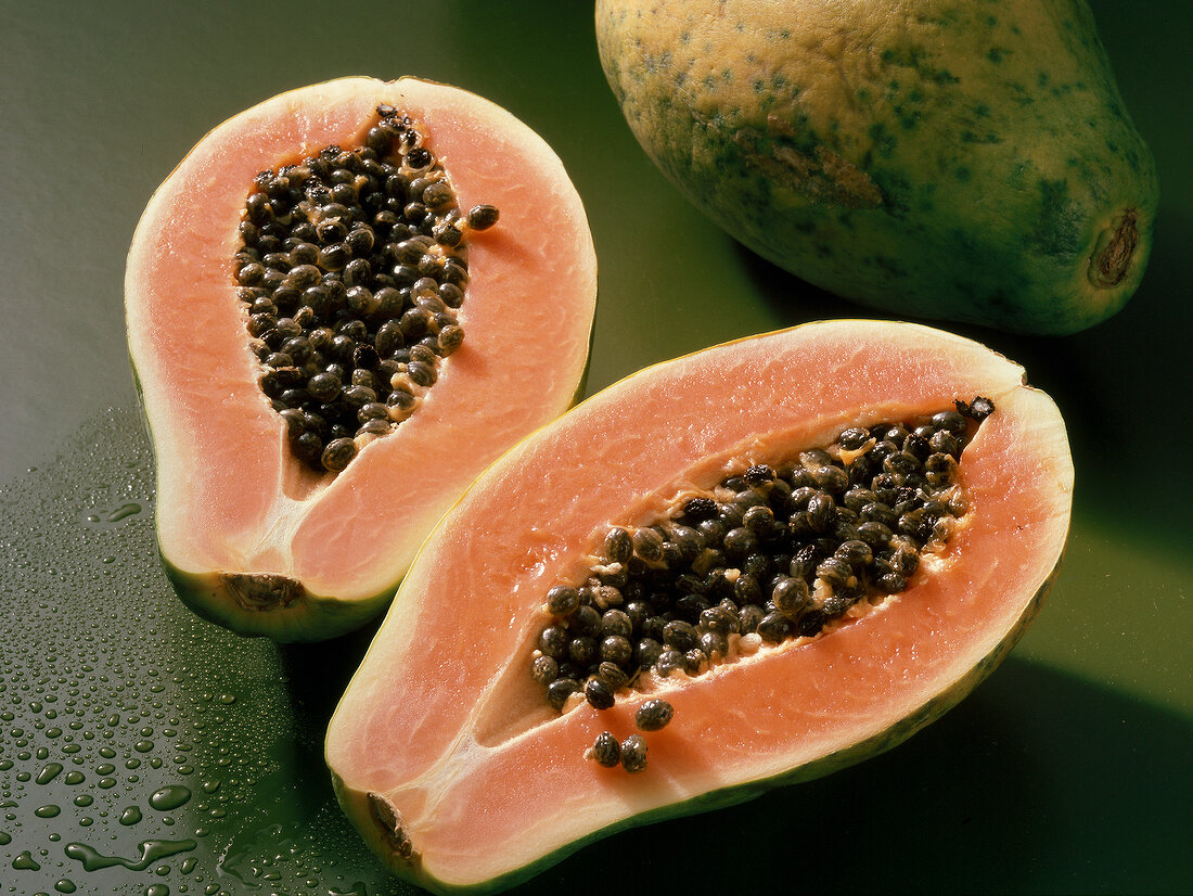 Halved ripe papaya with seeds