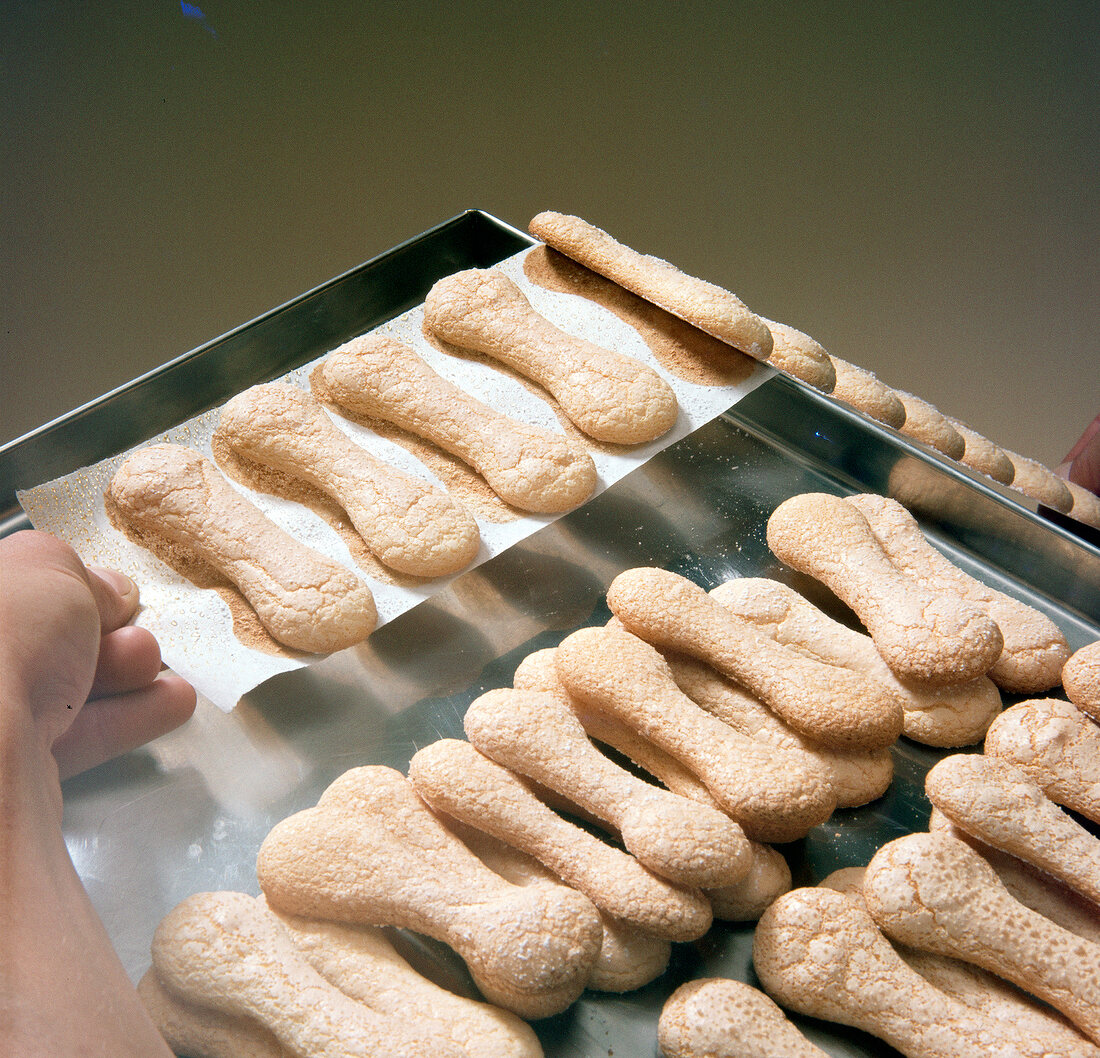 Baked biscuits being removed from sheet