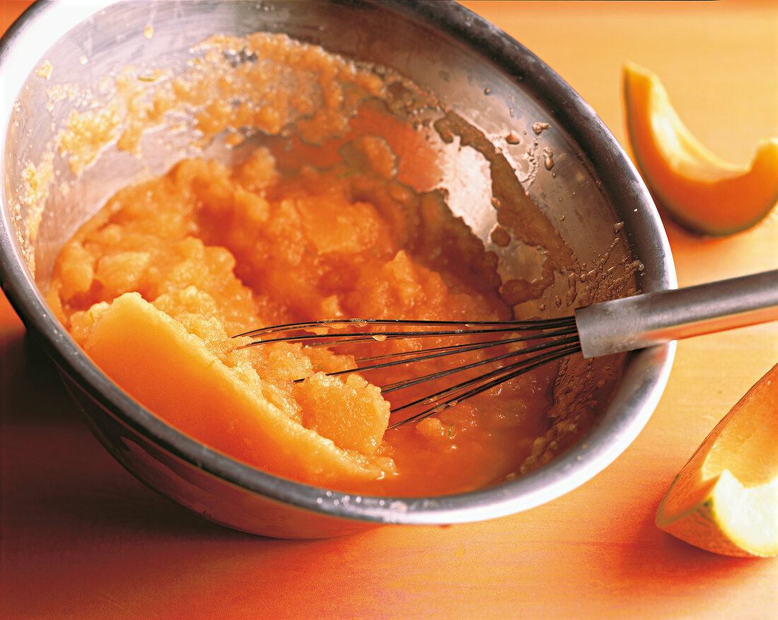 Sorbet being mixed in bowl with whisk