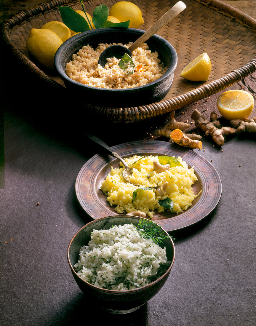 Brown rice, lemon rice, dill rice on plate with lemon and turmeric