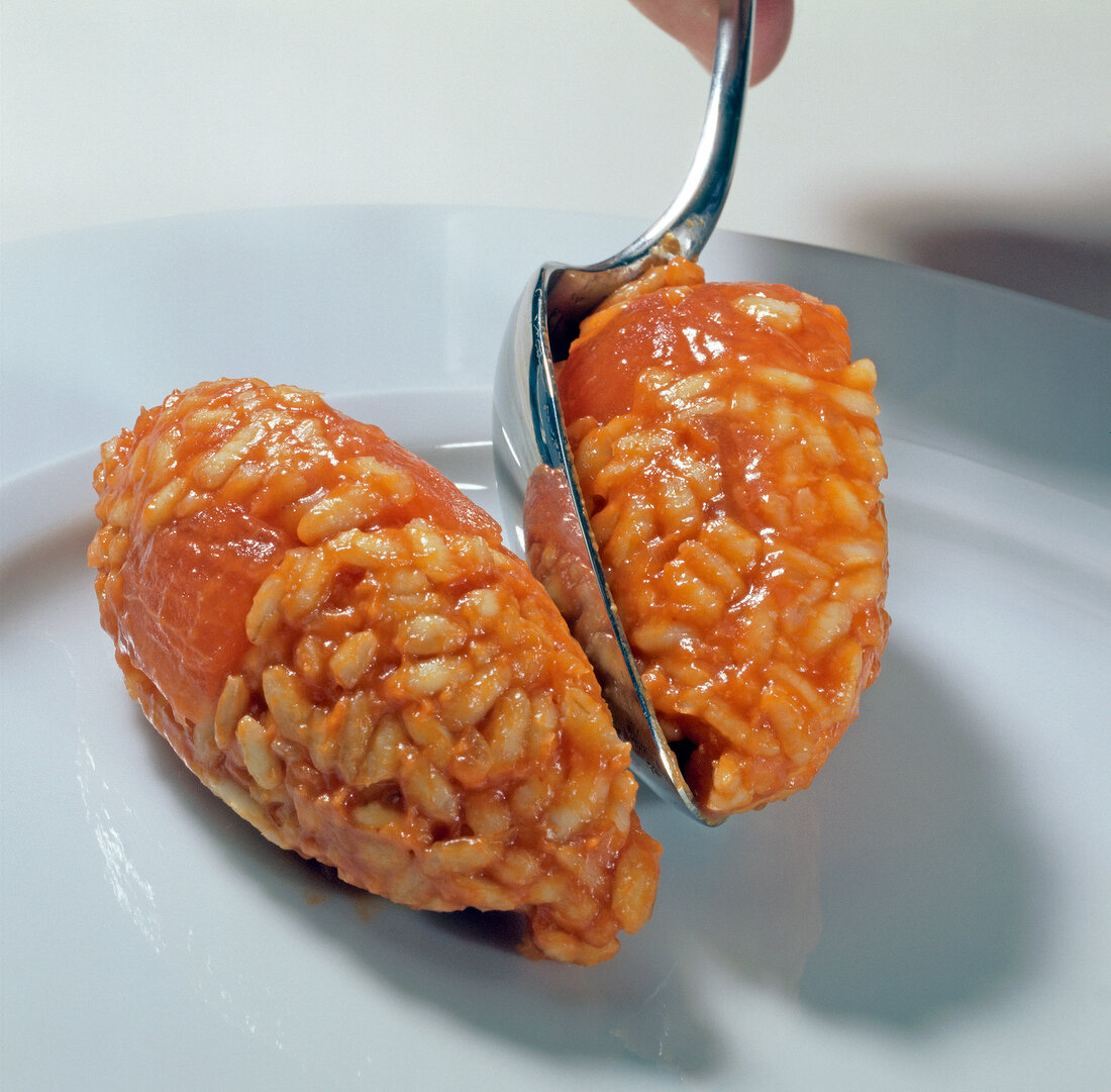 Close-up of tomato rice in round shape on plate