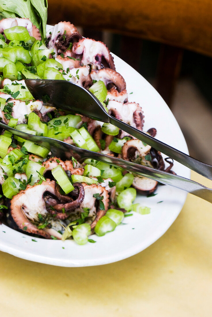Salad of celery and octopus in serving dish at La Vedova restaurant, Venice, Italy