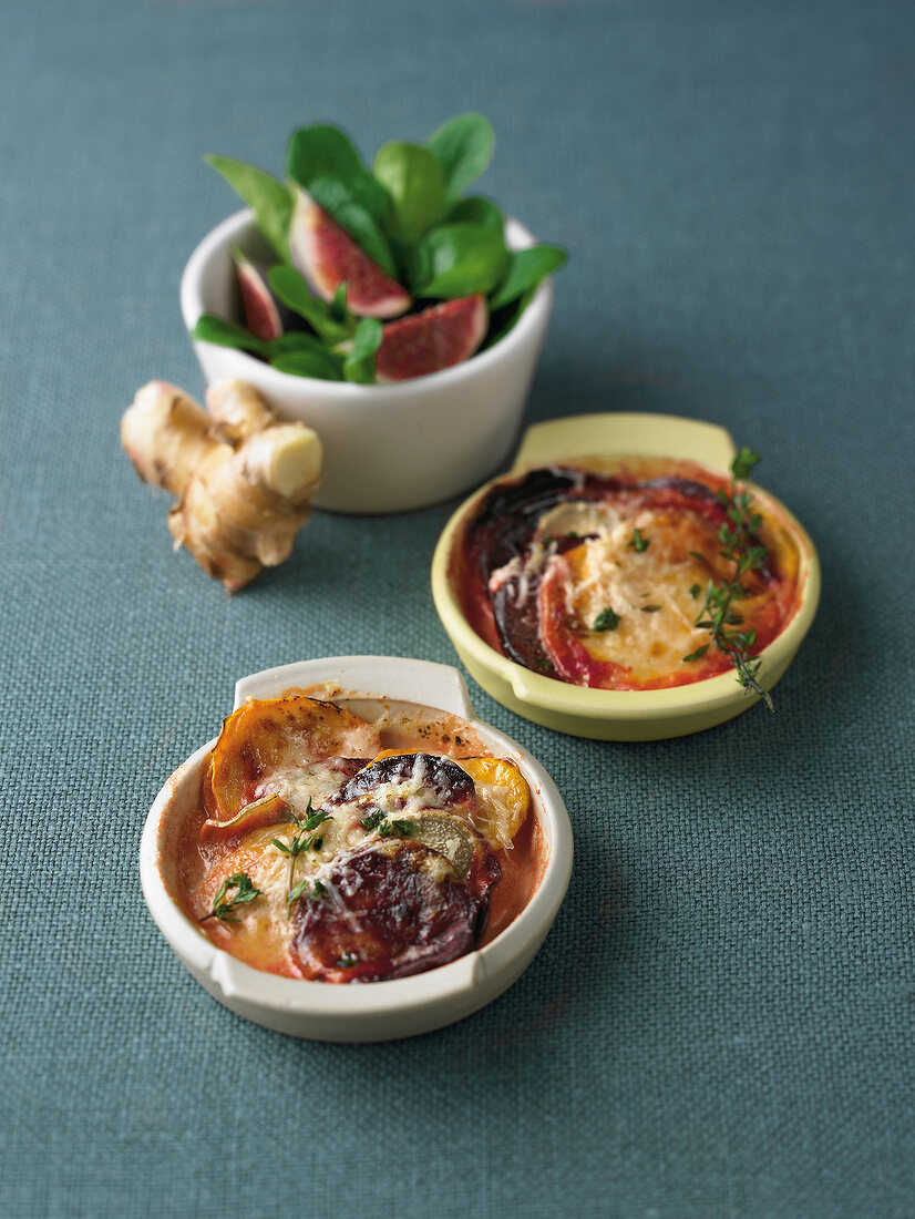 Beetroot and sweet potato gratin on gray background