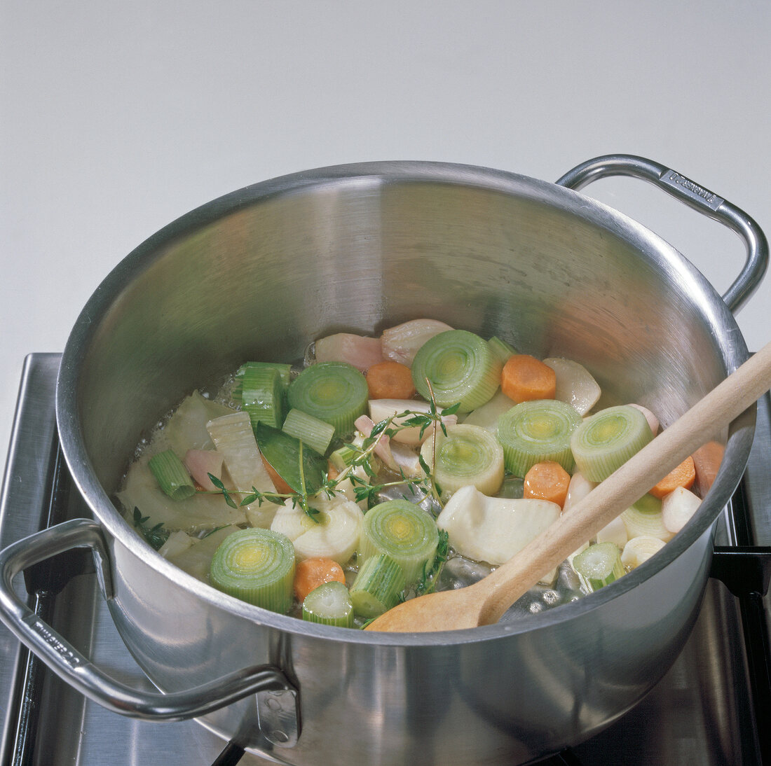 Vegetables being boiled in casserole, step 1