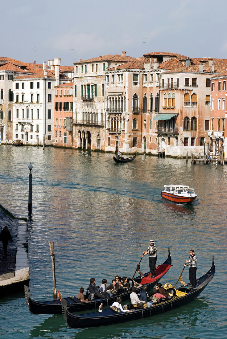 Tourists enjoying gondola ride in Grand Canal, Elevated View, Venice, Italy