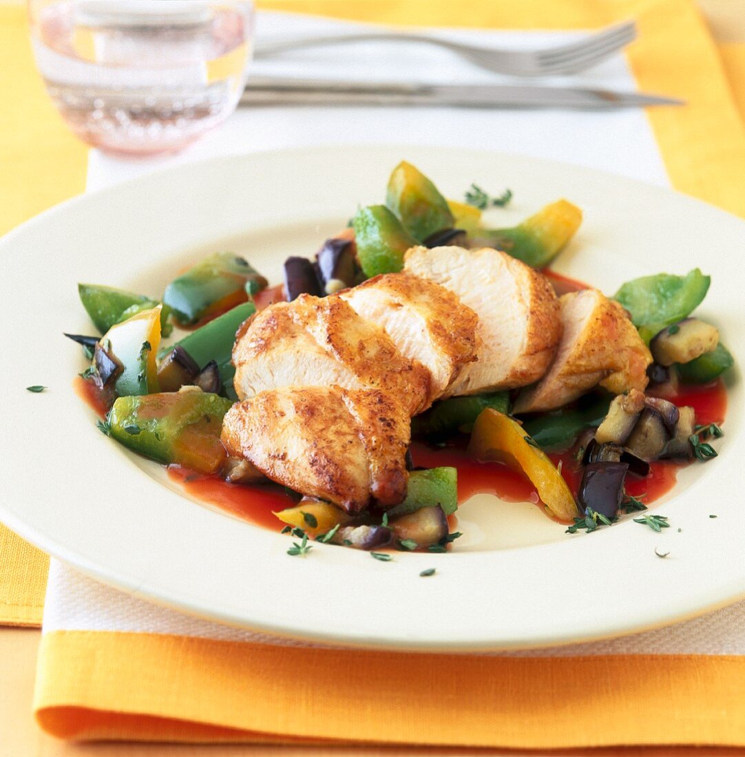 Chicken breast with an aubergine and pepper medley