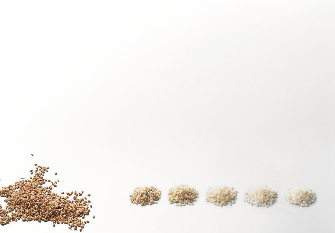 Various brown rice on white background
