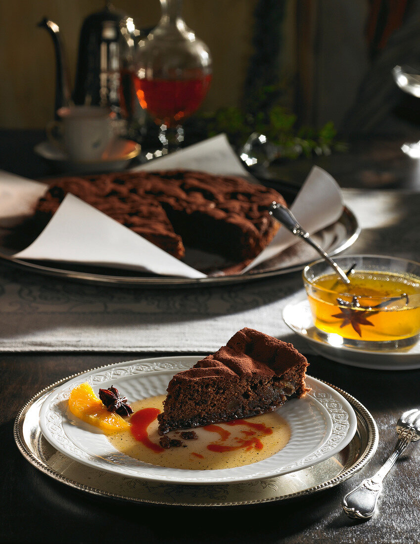 Chocolate cake with dates and almonds in spice syrup