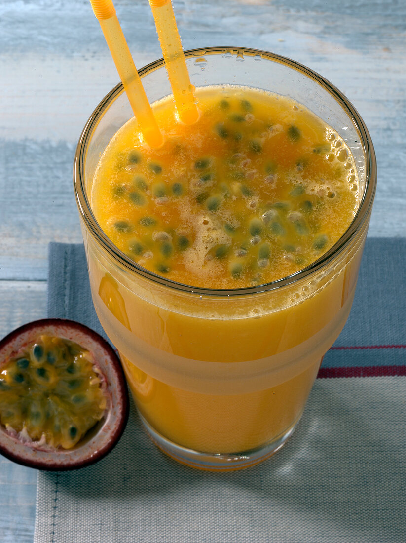 Close-up of long distance runner drink with two straws in glass