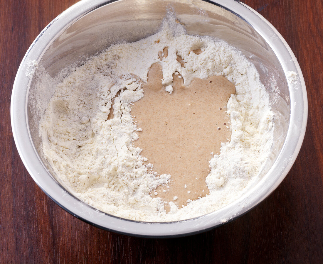 Leaven agent and dough in bowl for bread