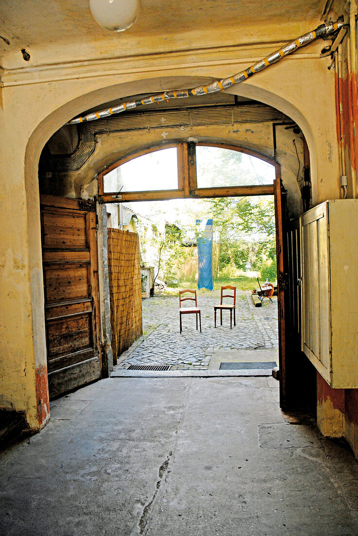 Two chairs at the entrance of backyard in Dresden, Germany