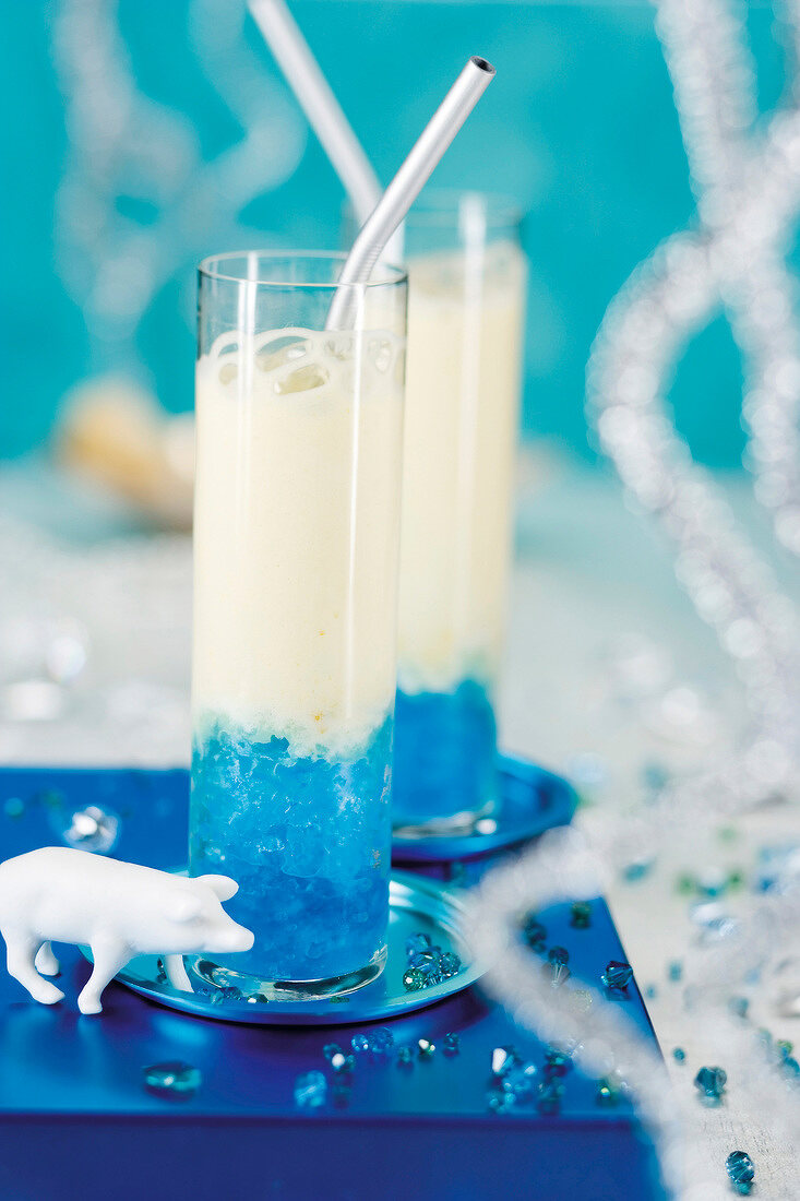 Dessert of curacao granita with orange sabayon in tall glasses