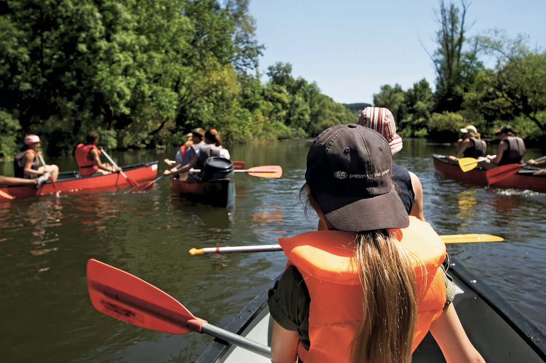 People canoeing in river at Keller Edersee National Park in Hessen, Germany