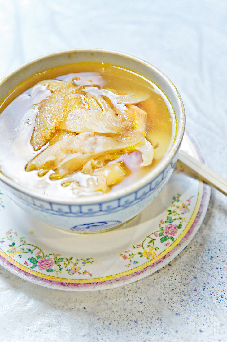 Shark fins with chicken broth in bowl
