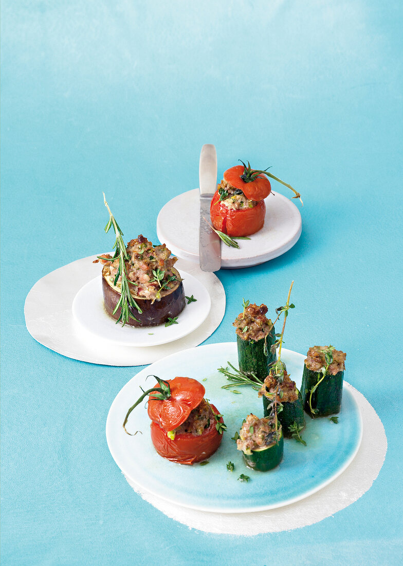 Stuffed eggplant, zucchini and peppers with rosemary and minced lamb on plate