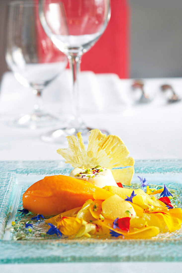 Sussdolden panna cotta with carrot and orange sorbet on plate