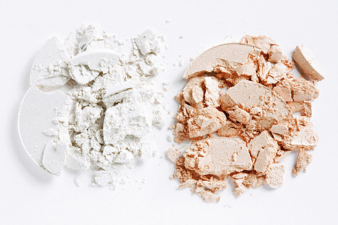 Loose white and brown eye shadows on white background