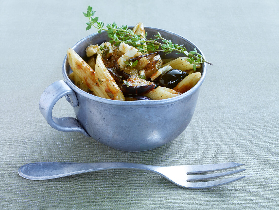 Eggplant pasta salad with thyme and black olives in cup