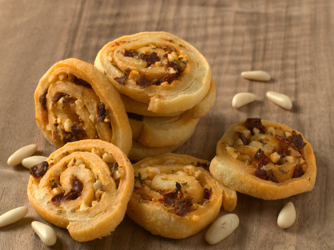 Tomato spirals biscuits on wooden background