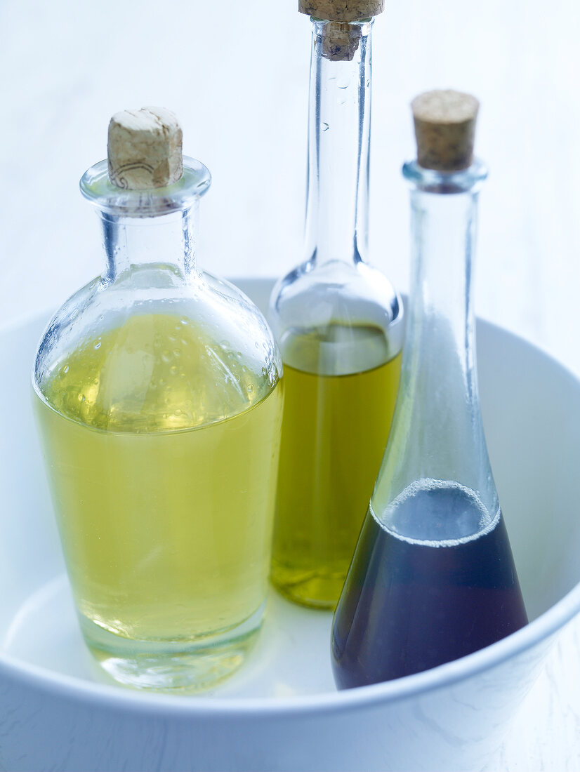 Three bottles of olive, soybean and sunflower oil