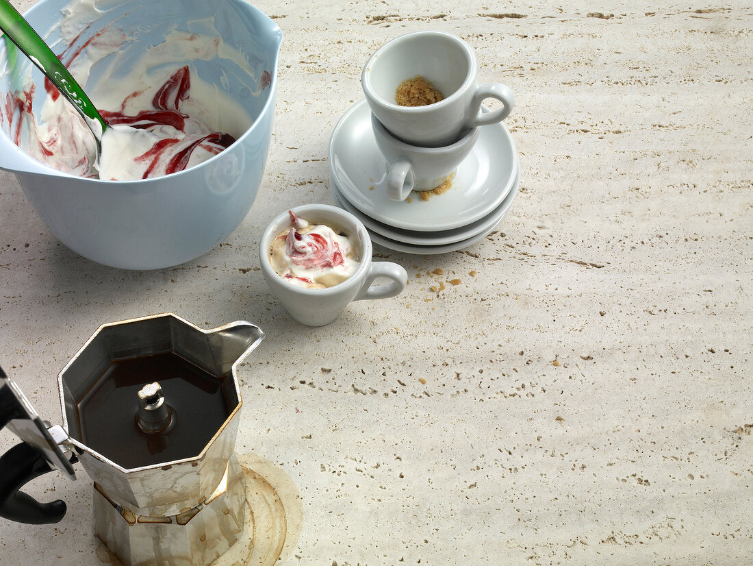 Cafeteria pot with caramel and bowl of cream with jam