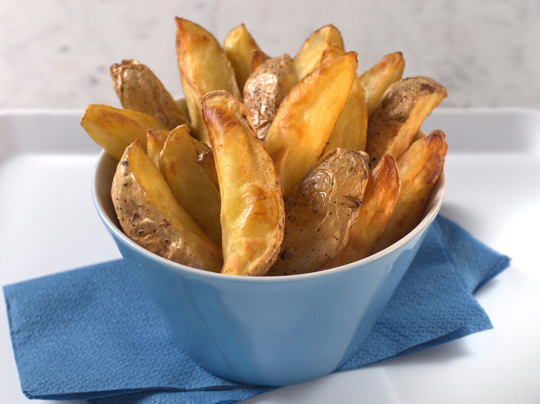 Fried potato wedges in bowl