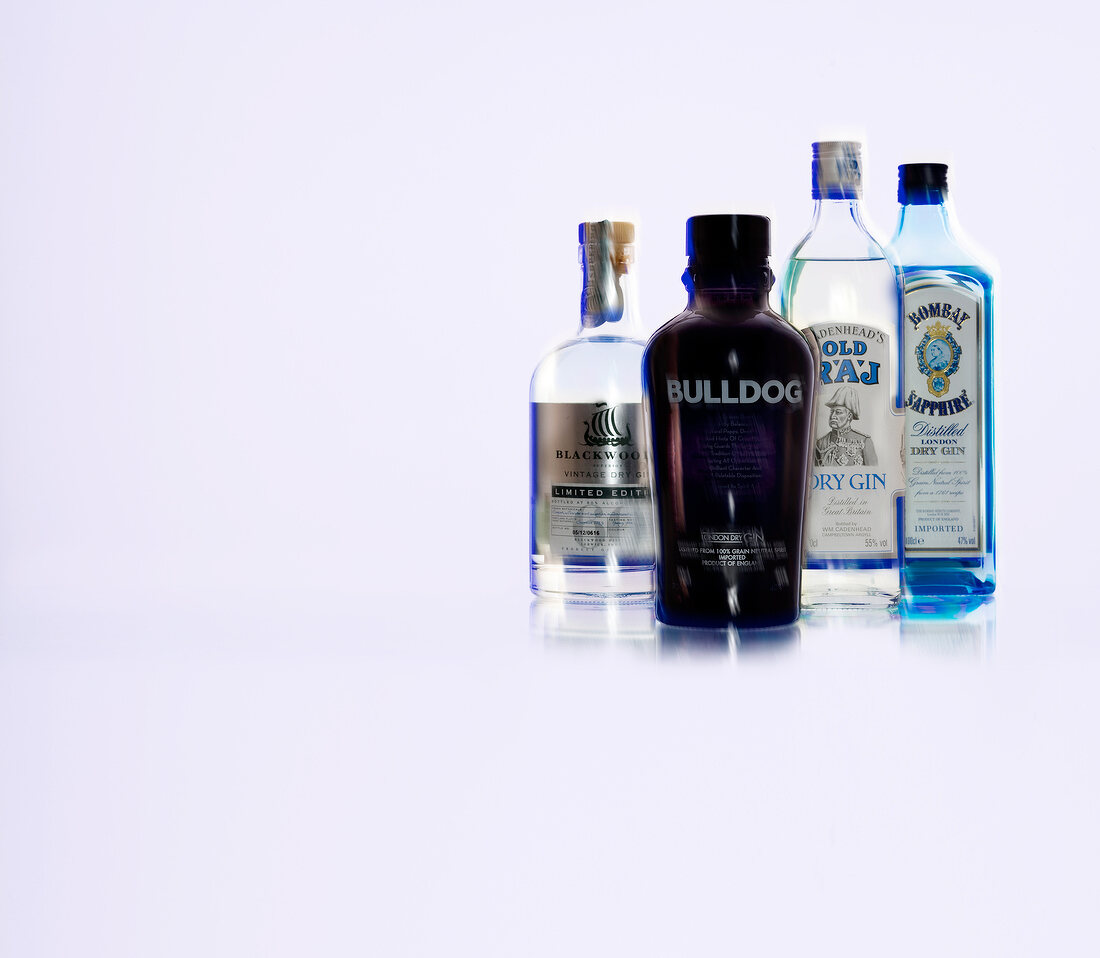 Four bottles of beer against white background