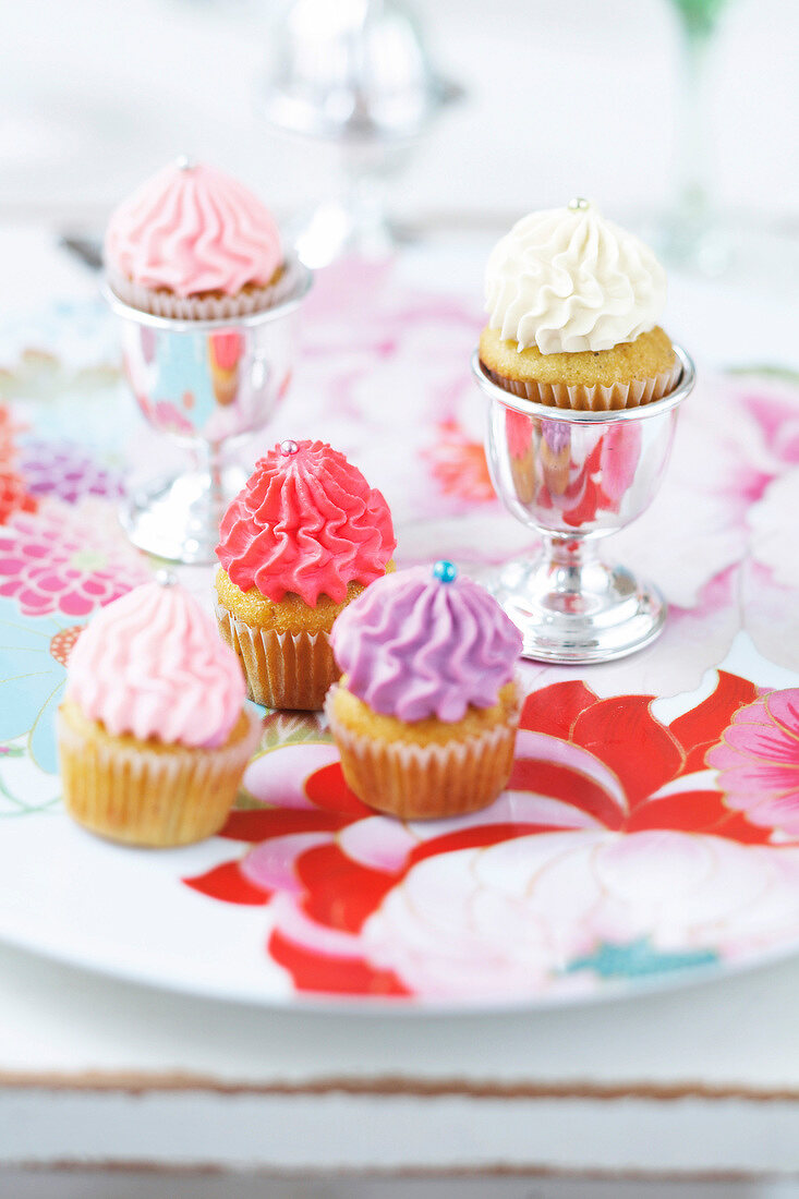 Close-up of mini muffins with mascarpone cream on plate