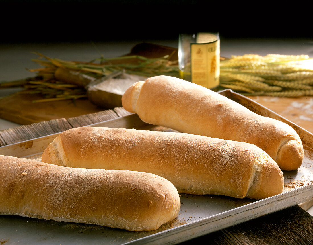 Three ciabatta bread on baking tray 