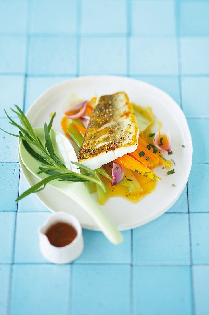 Pickled vegetables with crispy fried Zander fillet, carrots and herbs