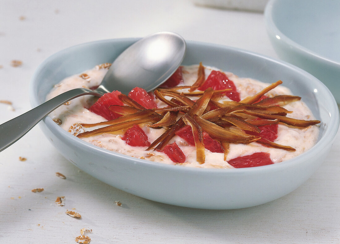 Banana oatmeal with grapefruit in bowl